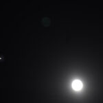 moon between jupiter and saturn